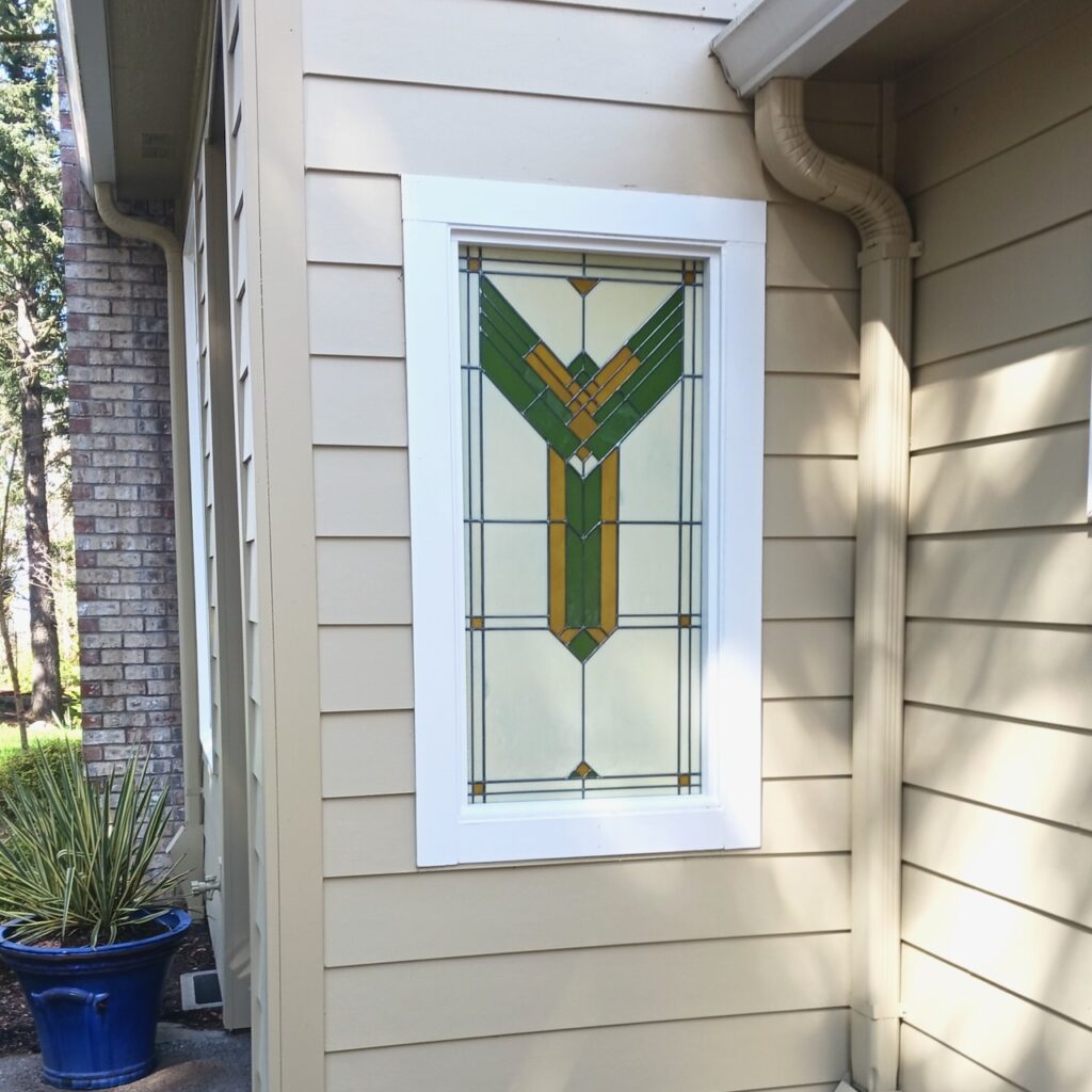 The Source stained glass entryway window exterior