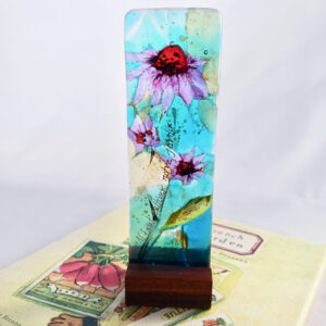 Fused Glass Sculpturette Lavender Echinacea - atop a book