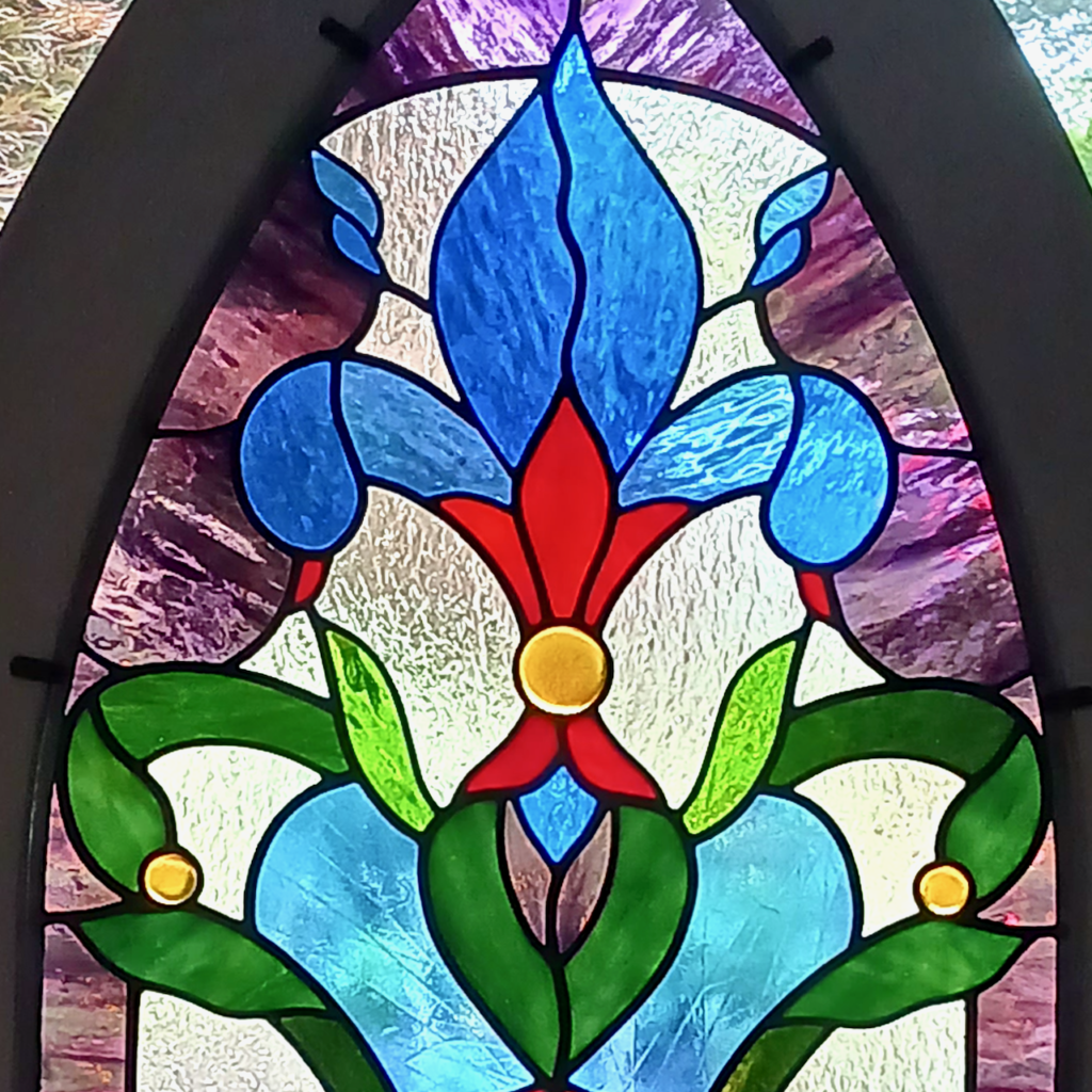 Fleur de Lys stained glass window - closeup